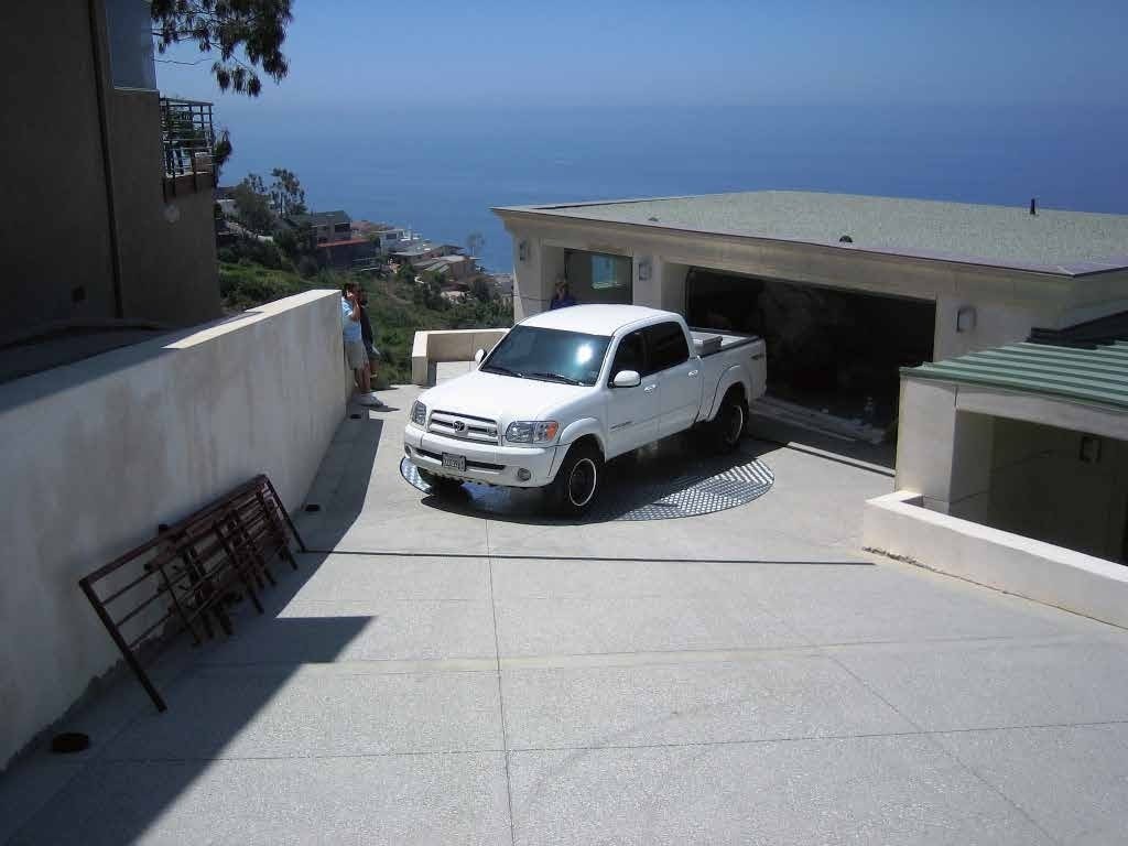 Phase 5 Completed low-profile residential driveway turntable operational and flush with surrounding stone
