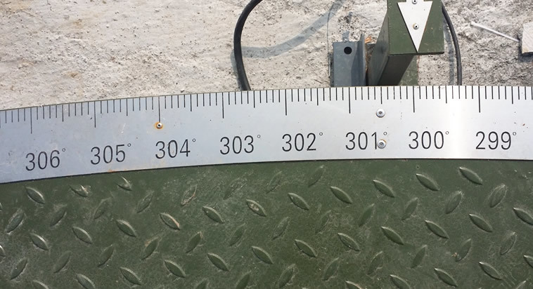 Detailed close-up of Weizhong automated turntable angular scaling system showing absolute indexing components
